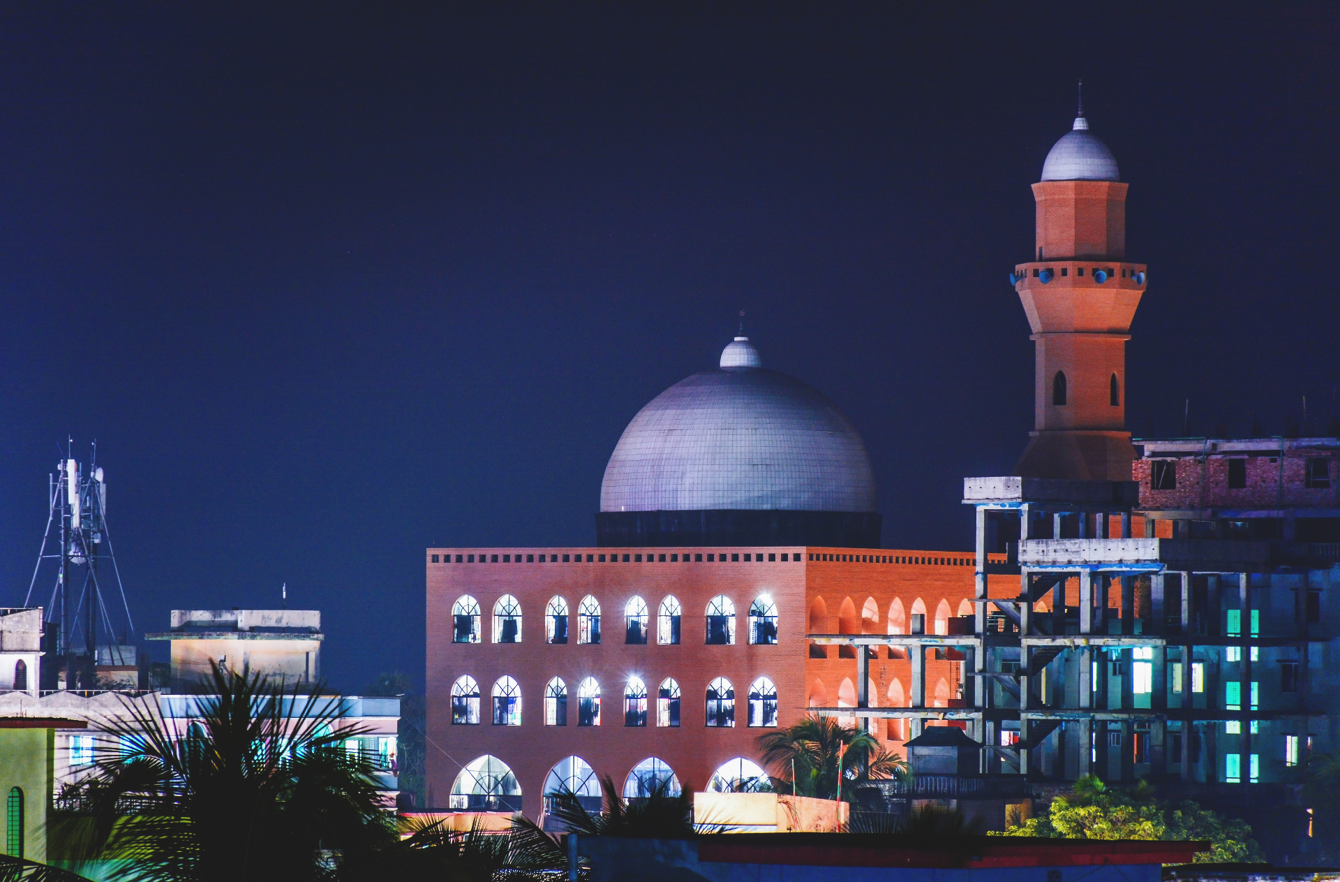 The Yunusia campus illuminated at night, where Allama Tajul Islam is buried